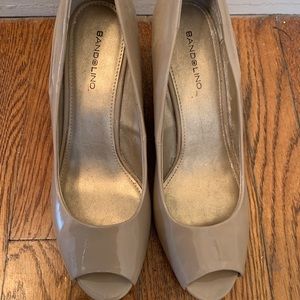 Like new tan peep toe wedges. Size 9.5.